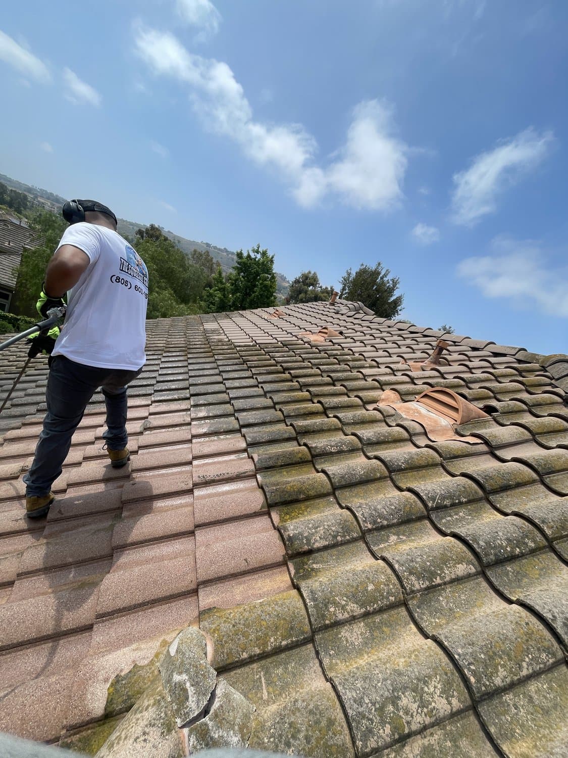 Squeegee Crew soft washing a tile roof in the 805